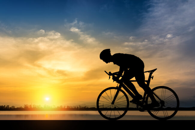 Silhouette of cyclist on the background of beautiful sunset